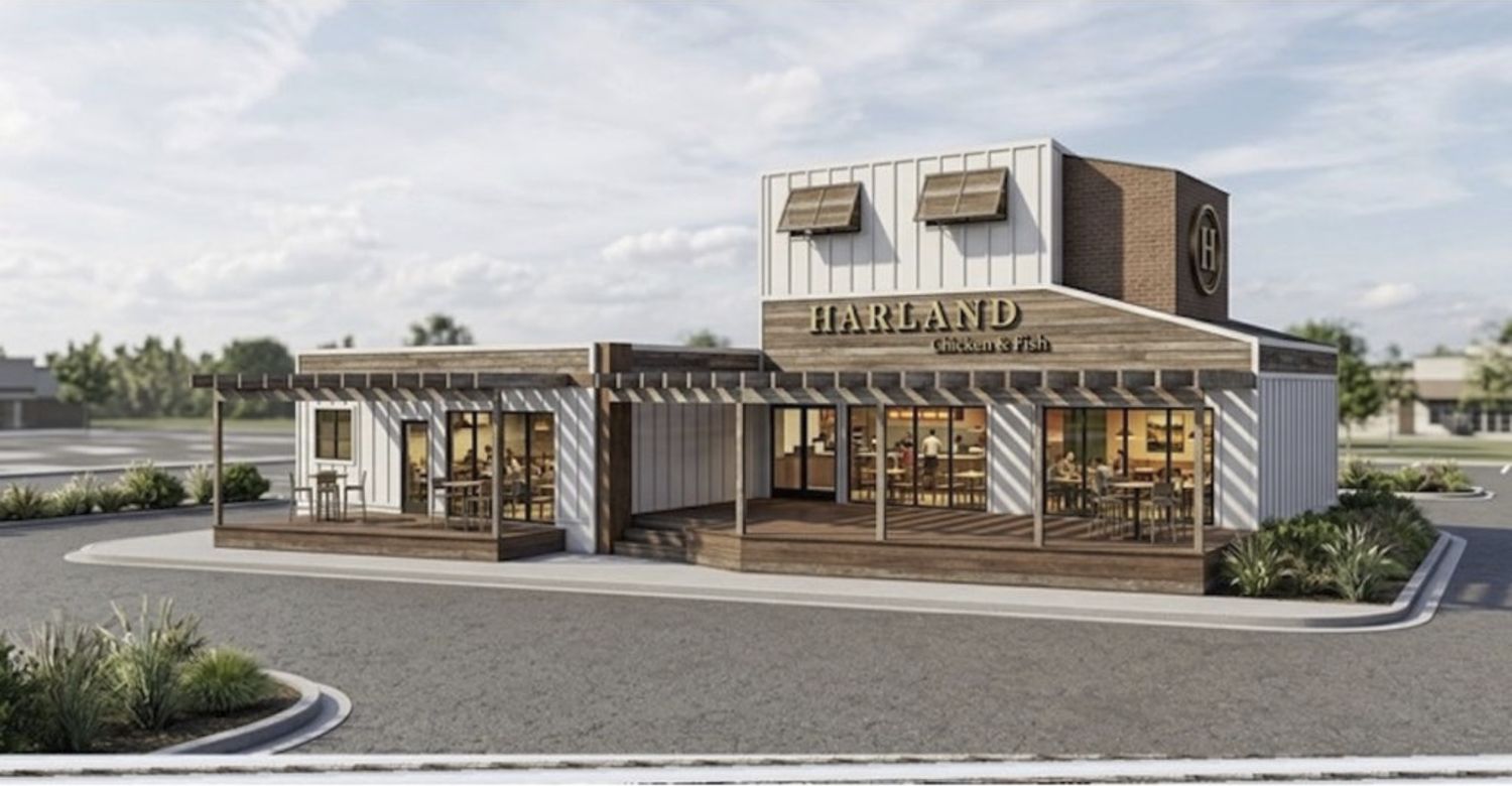 Architectural rendering of Harland Chicken & Fish in downtown Victoria, Minnesota — a single-story restaurant in reclaimed wood, white board-and-batten and corrugated metal with a covered patio and a circular H logo on a brick tower