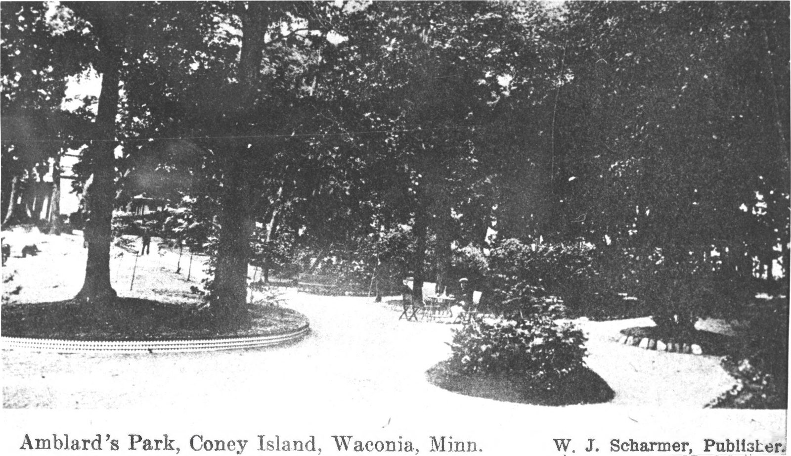 Historic postcard of Amblard's Park on Coney Island, with curving garden paths, tree beds, and cafe tables and chairs under large trees