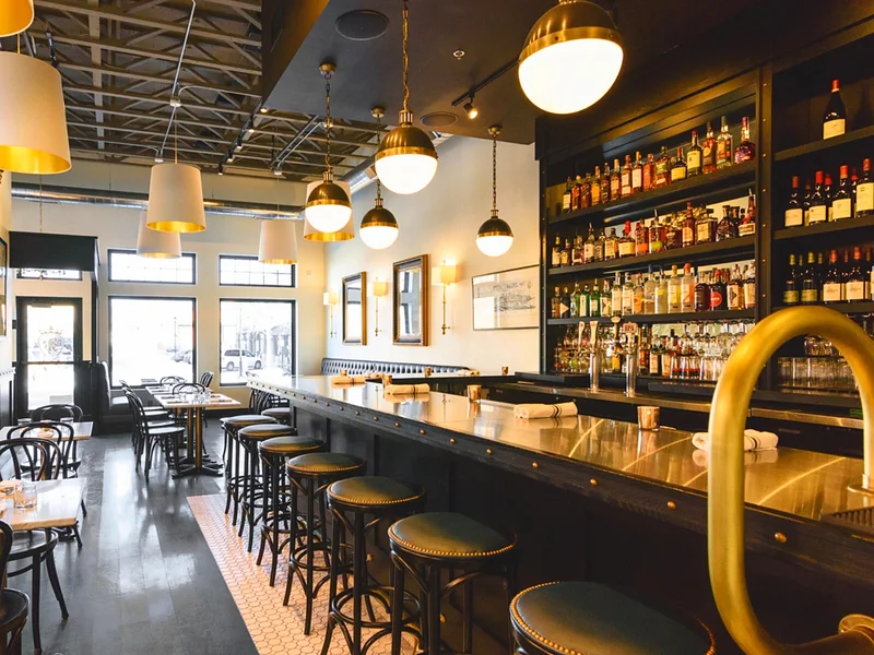 The long bar and dining room at The Noble Lion on Victoria Drive