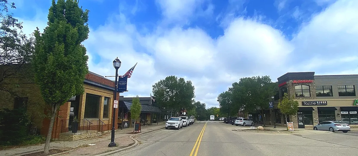 Shops and brick storefronts along Victoria Drive downtown