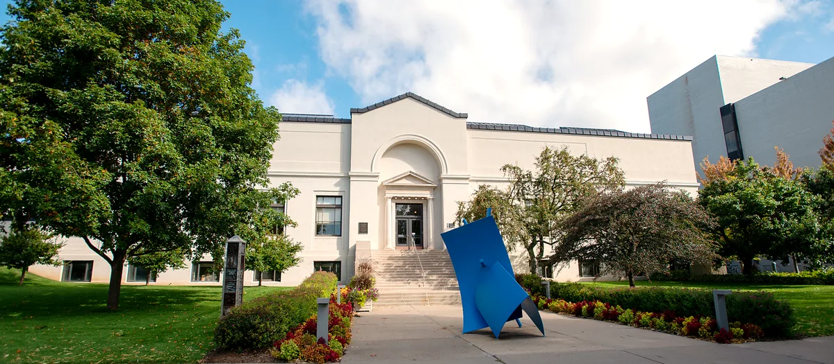 The MCAD campus on a sunny day, with a blue sculpture out front