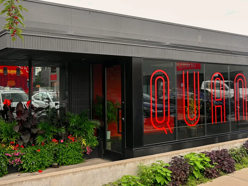 The Quang storefront with its red neon sign