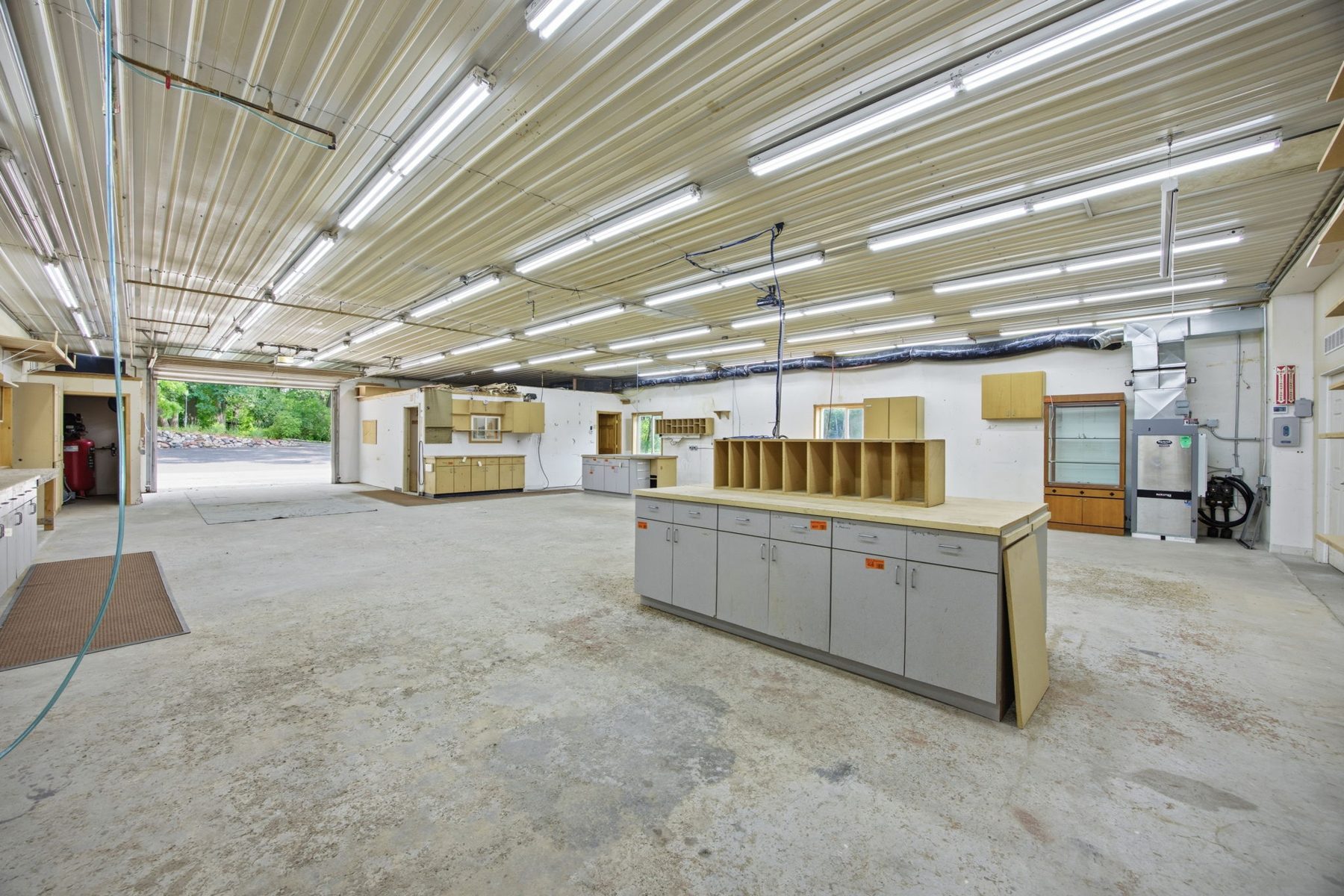 Inside the ~4,800 sq ft heated shop at 9765 261st Ave NW, Zimmerman