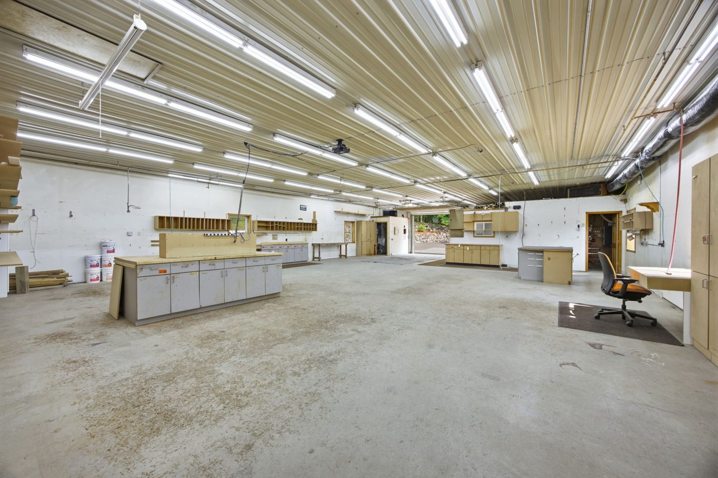 Inside the shop — workbenches and open floor